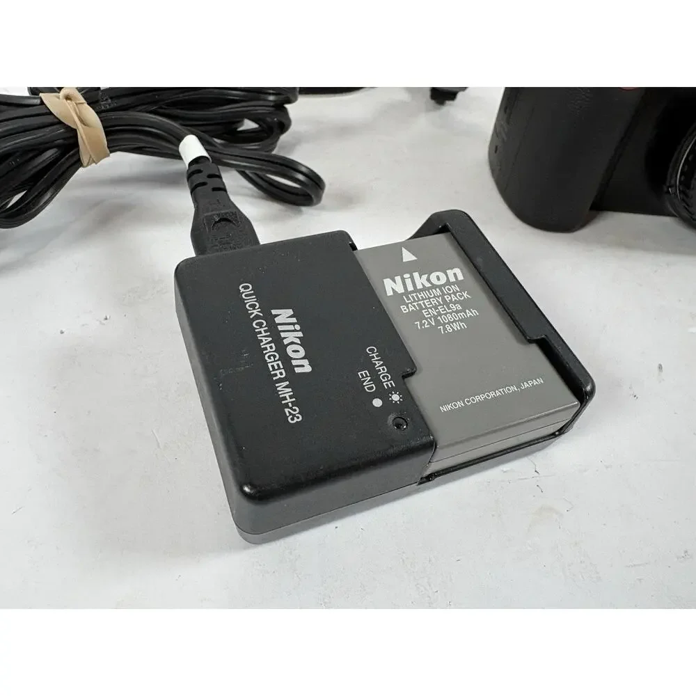 Nikon D3000 DSLR Camera Body EN-EL9 Battery Charger Strap Tested No Lens Kit